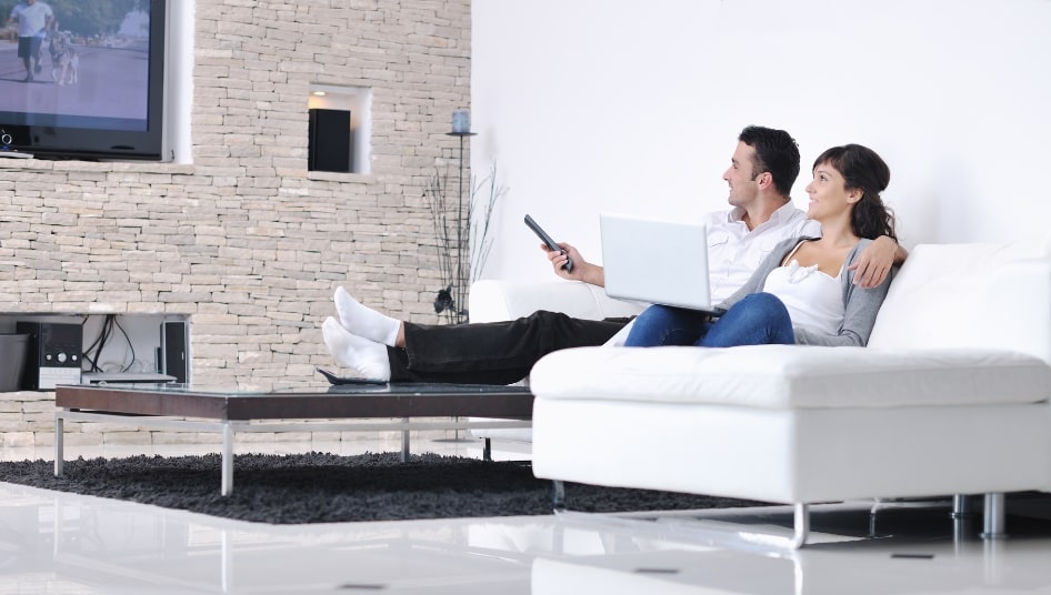 happy couple in warm living room