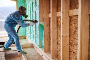 Man applying insulation